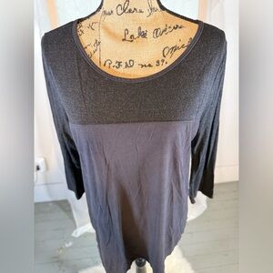 Black shirt, buttons on the back